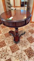 Full view of round mahogany accent table