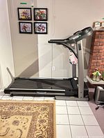 Side view of Tempo Fitness 621T treadmill showing full frame and belt