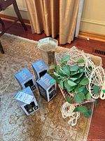 Overall view: four boxed terrariums, glass vase, macramé hangers with planter