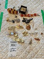 Full lot overview with tag showing all jewelry pieces