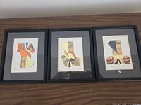 three black frames with abstract Asian paper collages