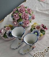 Overall view: centerpiece, two candle holders and pair of decorative boots