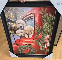 Front view of framed print with puppies in red truck