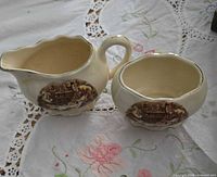 creamer pitcher and sugar bowl front view