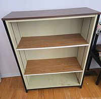 Front view showing overall structure, two shelves, interior wear