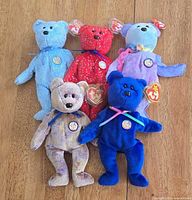 Group shot of five Ty Beanie Babies bears showing colours, badges and tags