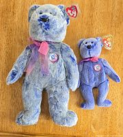 Front view of both Periwinkle bears showing size difference, colors, bows, and swing tags