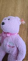 Pink Ty bear front showing bow, embroidery, tag