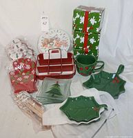 All items grouped showing mugs, leaf plates, glass plates, baking pan, textiles, spatulas