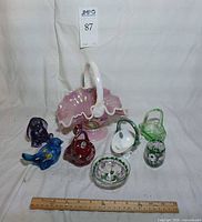 Group shot of all eight glass items with ruler for scale