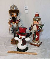 Three nutcrackers grouped together for size comparison