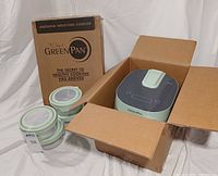 Rice cooker in box, four glass containers, induction cooktop carton