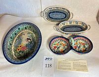All four Polish stoneware pieces with certificate and lot card visible