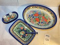 Overview of casserole, baker with ladle, salt and pepper set on tray