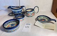 All six Polish pottery pieces grouped together