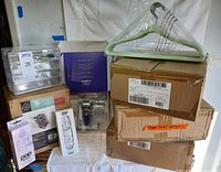 Lot overview showing pedicure kit box, acrylic organizers, POP Sonic device boxes, hangers and shipping cartons