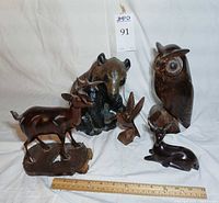 Group shot of four carved wood figurines