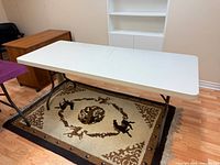 Full view of rectangular folding table standing on rug