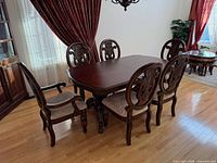 Dining table with six chairs, view from front left