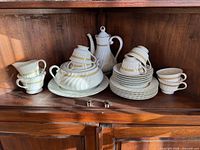 Full lot displayed in cabinet showing all pieces stacked