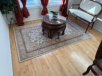 Full view of wool area rug on hardwood floor