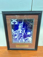 Full view of framed autographed Doug Flutie photo