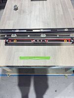 Two larger levels and small torpedo level on table