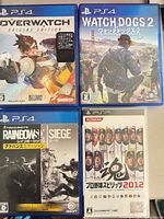 Front covers of Overwatch Origins Edition, Watch Dogs 2, Tom Clancy’s Rainbow Six Siege, Pro Yakyuu Spirits 2012