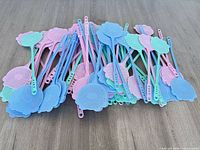 Pile of assorted pastel fly swatters