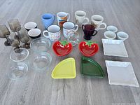 Overall lot layout showing all drinkware, bowls and plates