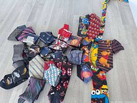 Pile of assorted ties spread on floor