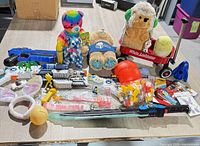 Overview of the mixed toy lot on table