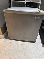 Front view of Haier compact refrigerator closed
