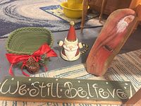 Group shot showing all four items: teapot, driftwood art, braided basket with pinecone, and wood sign
