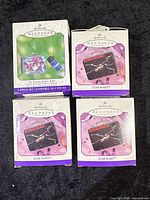 Four Hallmark Keepsake ornament boxes: three 1998 Star Wars mini lunchboxes and one 2001 Empire Strikes Back 2-piece set