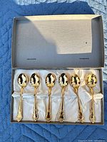 Set of six gold-plated spoons in satin-lined box