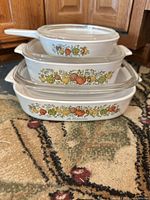 Front view showing all three Spice of Life casseroles stacked with lids