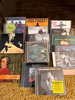 Group image showing all 15 CD jewel cases front covers