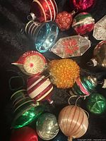 Group of approximately 12 vintage glass Christmas ornaments of various shapes and colours