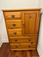 Front view of pine highboy with drawers and cupboard