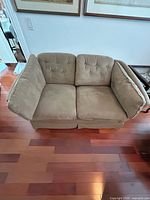 Front view of beige two-seater loveseat