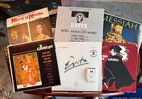 Group shot of six LP jackets including Man of La Mancha, Evita, Camelot, Cyrano, Messiah