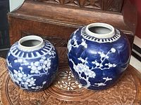Two blue and white bulb vases front view