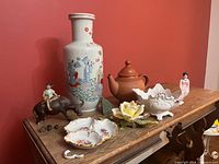 Group view of all ceramic items and fragments on table