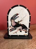 Front view showing toucan mosaic and overall form