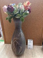 Vase front view with horse motif and ceramic roses