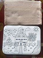 Woven placemat stacked beside Naiad placemat showing illustration