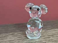 Front view of Swarovski clear faceted crystal bear figurine showing overall design and base