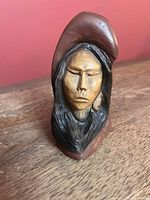 Full view of signed Thomas Maracle Indigenous woman sculpture