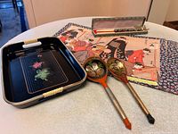 Overview showing tray, wooden spoons, cloisonné chopsticks in case and one placemat